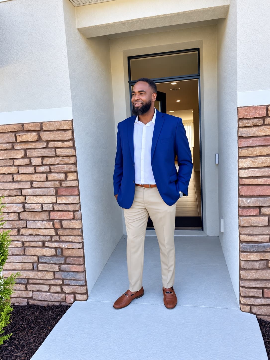 Paul E. in a blue blazer outside a Central Florida home
